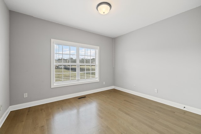 empty room with light wood-type flooring