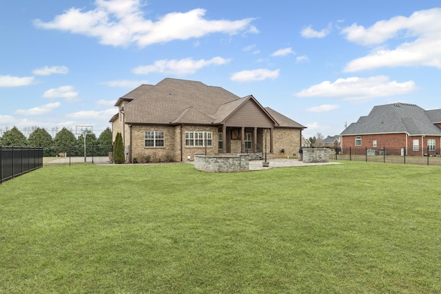 back of house with a patio area and a lawn