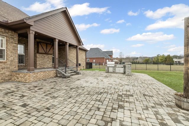 view of patio / terrace featuring exterior kitchen