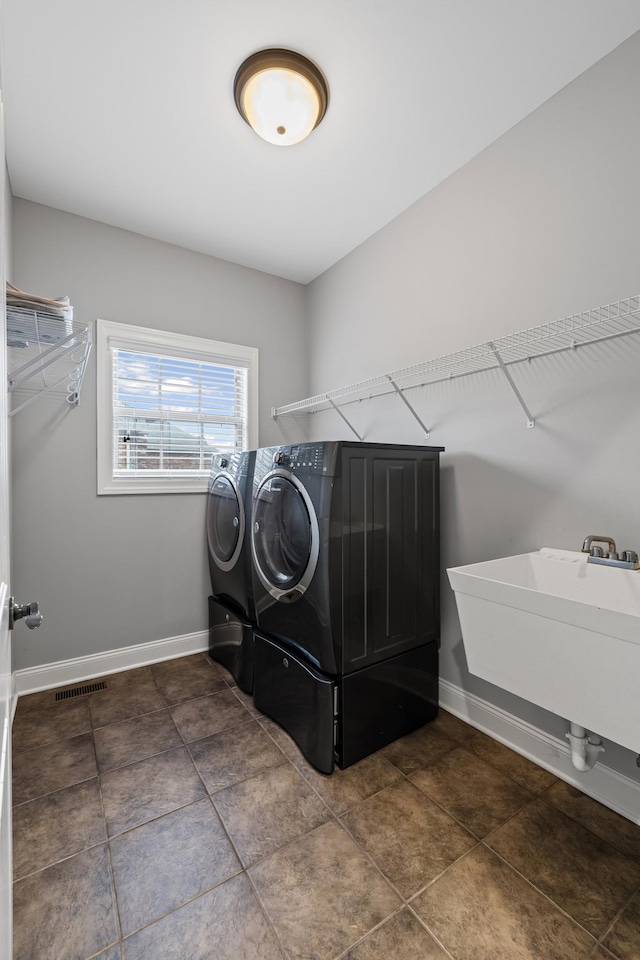 laundry area with washer and clothes dryer