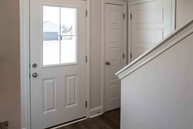 doorway with dark wood-type flooring and plenty of natural light