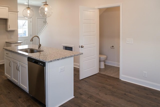 kitchen featuring sink, white cabinetry, decorative light fixtures, a center island with sink, and dishwasher