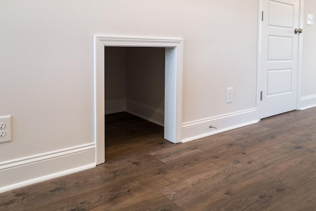 spare room with dark hardwood / wood-style flooring