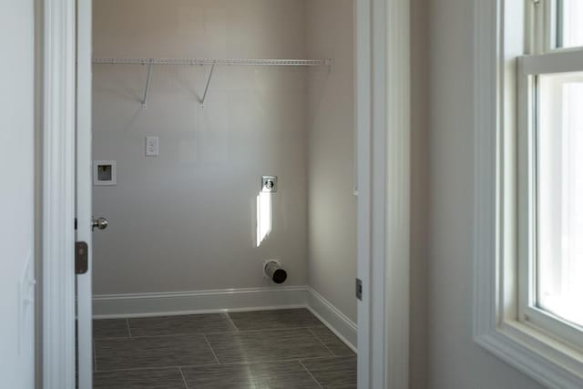 clothes washing area with electric dryer hookup and hookup for a washing machine