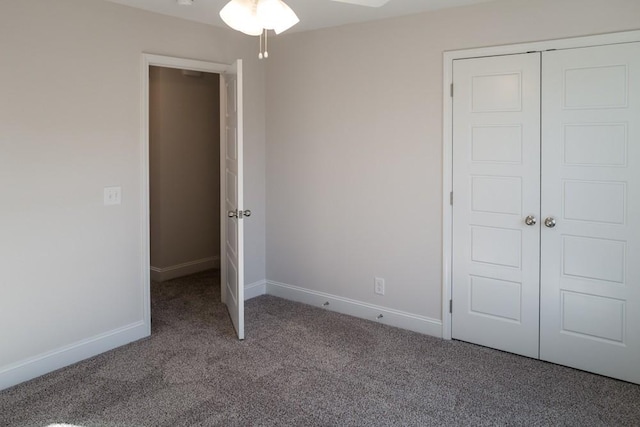 unfurnished bedroom featuring carpet floors and a closet