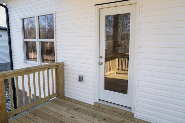 doorway to property with a wooden deck