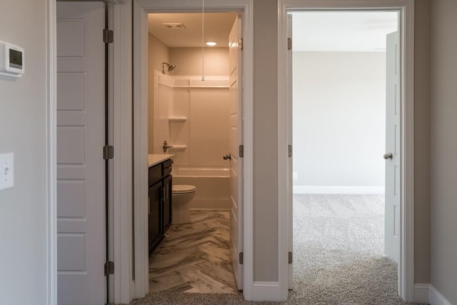 full bathroom featuring vanity, shower / washtub combination, and toilet