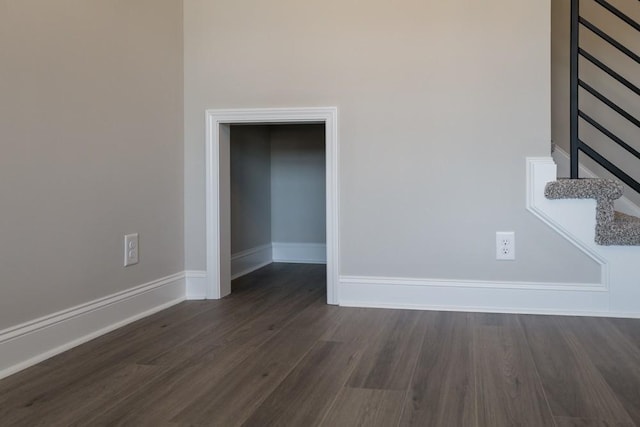 spare room with dark hardwood / wood-style flooring