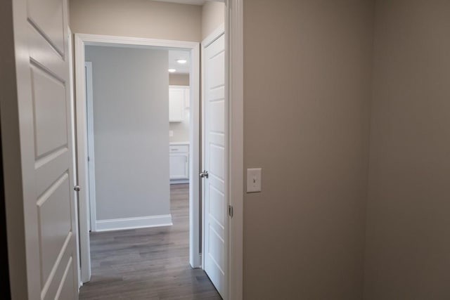 hall with dark hardwood / wood-style floors