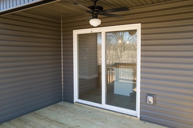 wooden deck featuring ceiling fan