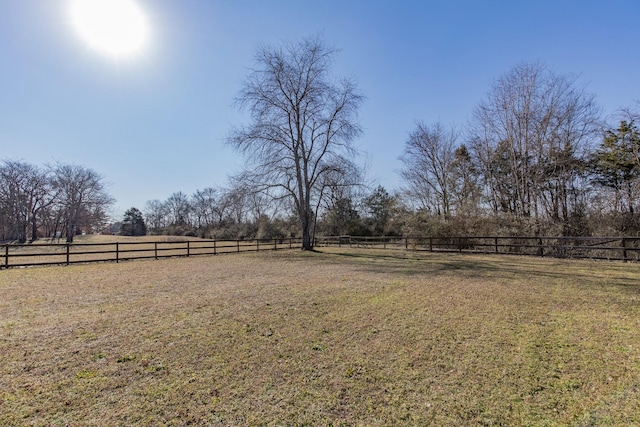 view of yard with a rural view