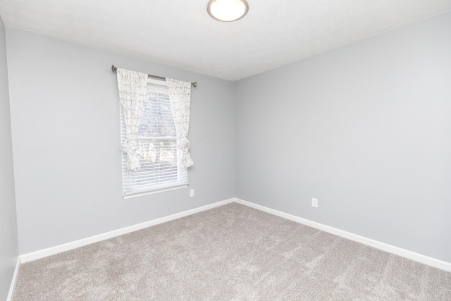 spare room featuring carpet flooring