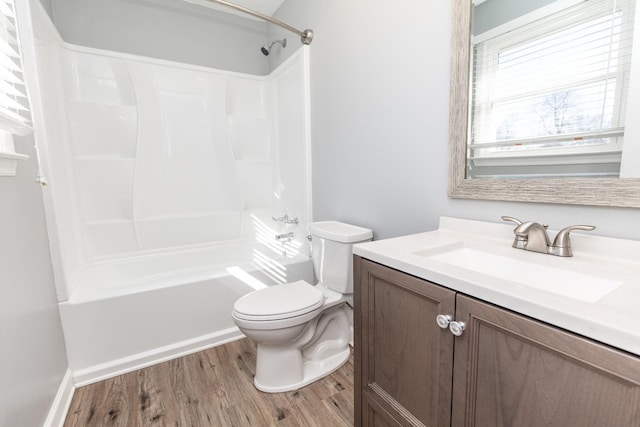 bathroom with vanity, hardwood / wood-style floors, and toilet