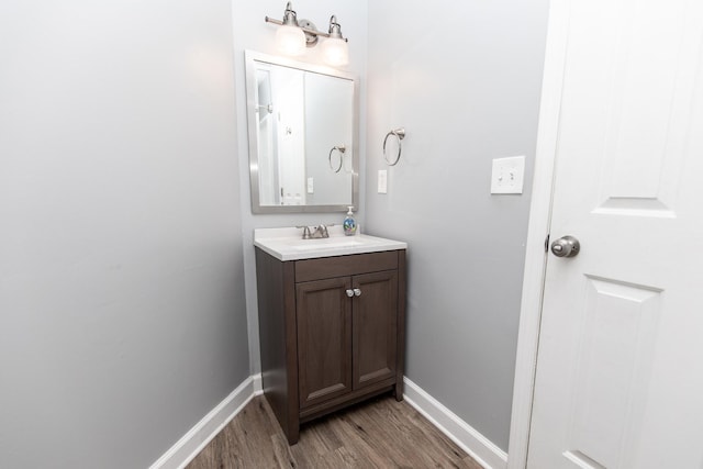 bathroom featuring vanity and hardwood / wood-style floors