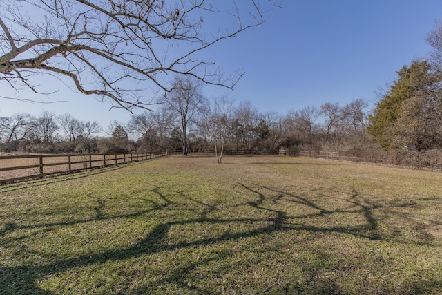 view of yard with a rural view