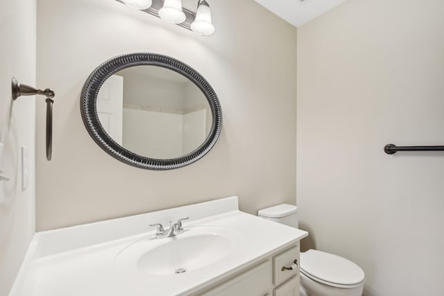 bathroom with toilet and vanity