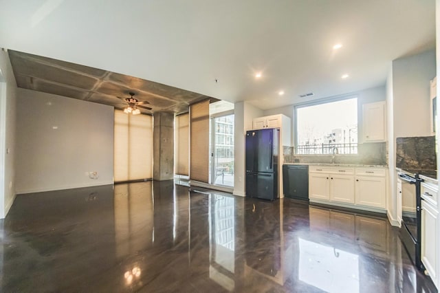 kitchen featuring sink, ceiling fan, tasteful backsplash, black appliances, and white cabinets