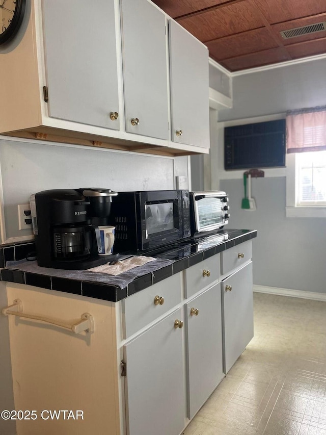 kitchen featuring white cabinetry
