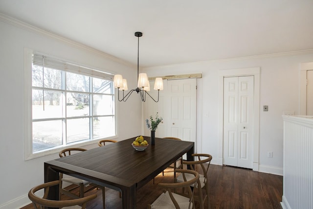 dining space featuring an inviting chandelier, ornamental molding, and dark hardwood / wood-style floors