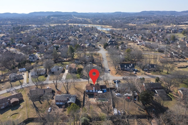 birds eye view of property with a mountain view