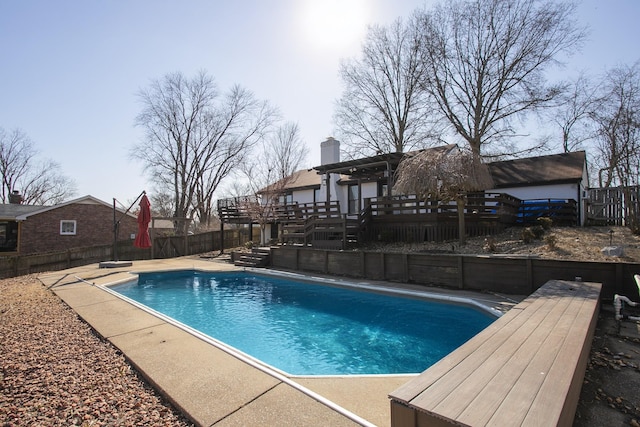 view of pool with a pergola, a deck, and a diving board