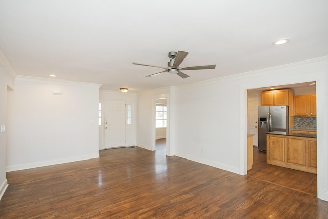 unfurnished living room with ceiling fan, crown molding, and dark hardwood / wood-style flooring