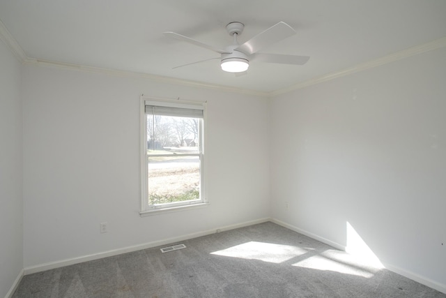 unfurnished room with carpet, ceiling fan, and ornamental molding