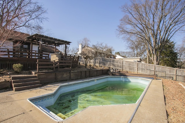 view of pool with a wooden deck