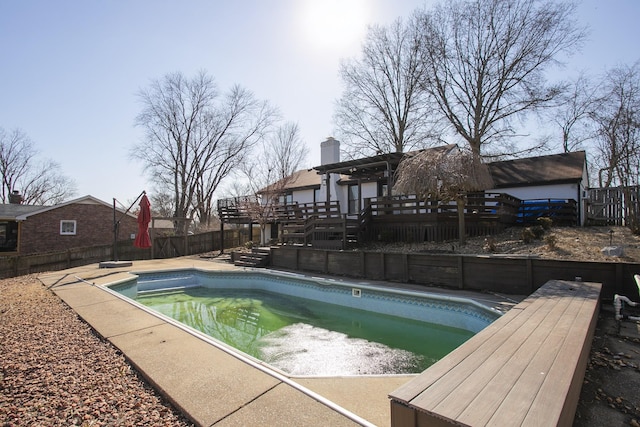 view of pool featuring a wooden deck and a pergola