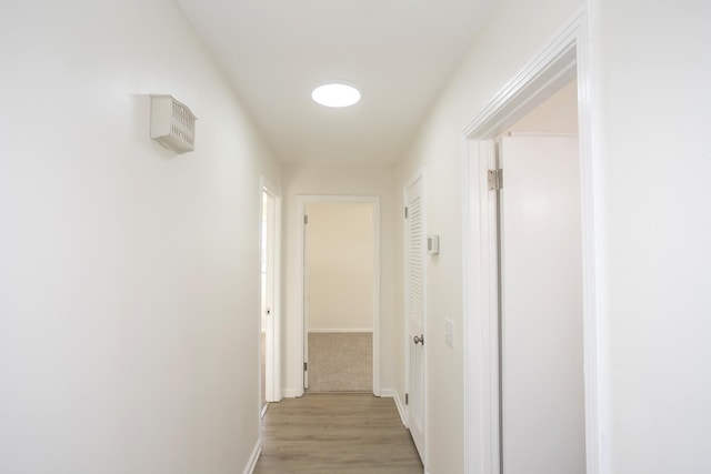 hall with light wood-type flooring