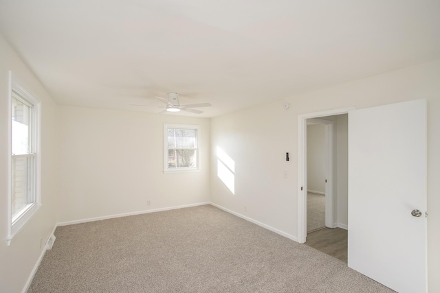 empty room with light carpet and ceiling fan