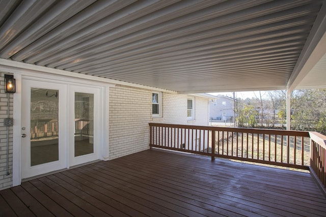 wooden deck featuring french doors