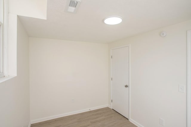 unfurnished room with light hardwood / wood-style flooring