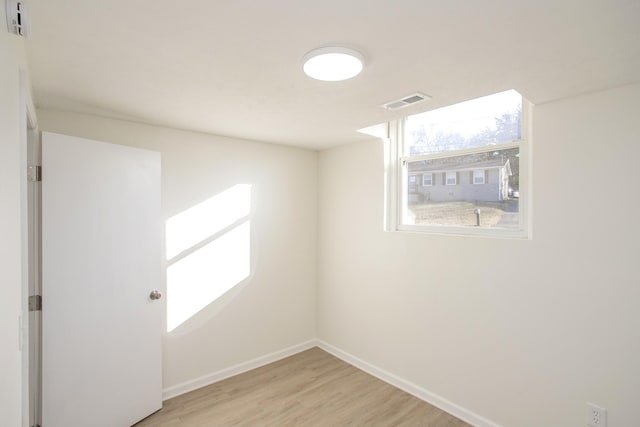 spare room featuring light wood-type flooring