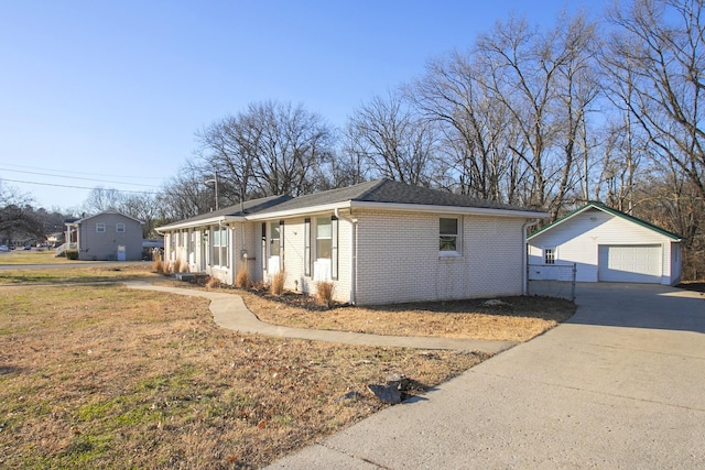 view of front of property with a garage and an outdoor structure