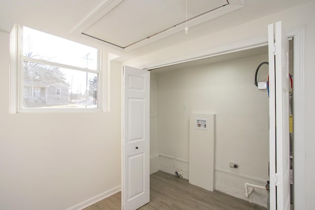 laundry area featuring washer hookup and hardwood / wood-style floors