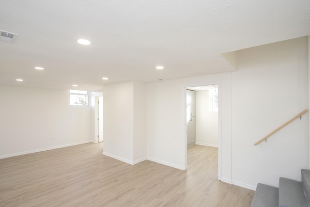 unfurnished room with light hardwood / wood-style floors