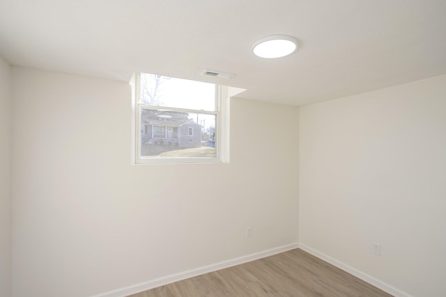 spare room with light hardwood / wood-style flooring