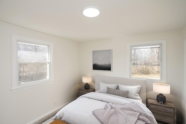 bedroom with multiple windows