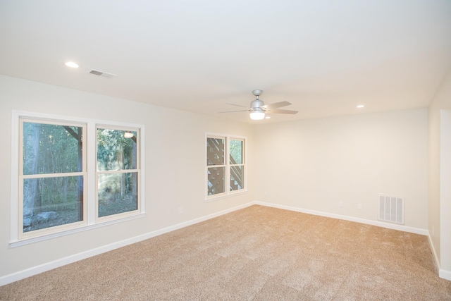 carpeted empty room with ceiling fan