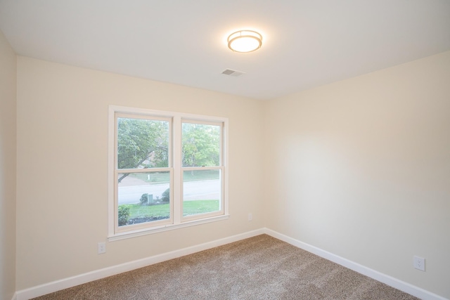 empty room featuring carpet floors