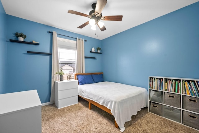 bedroom with light carpet and ceiling fan