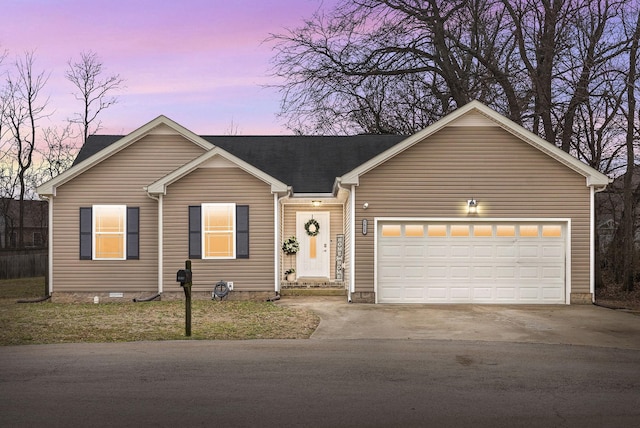 ranch-style house featuring a garage