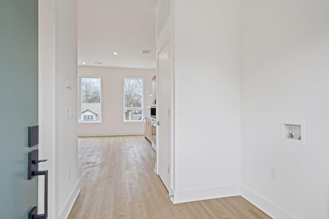 hallway featuring light hardwood / wood-style flooring