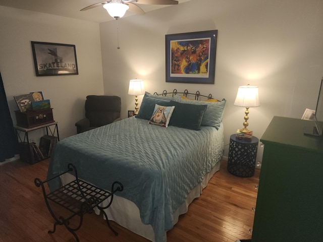 bedroom with hardwood / wood-style floors and ceiling fan