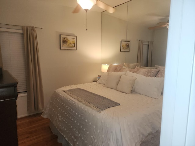 bedroom featuring dark hardwood / wood-style floors and ceiling fan