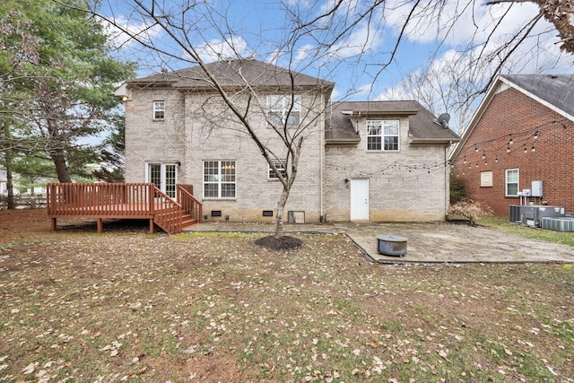 back of house with a deck and a patio area