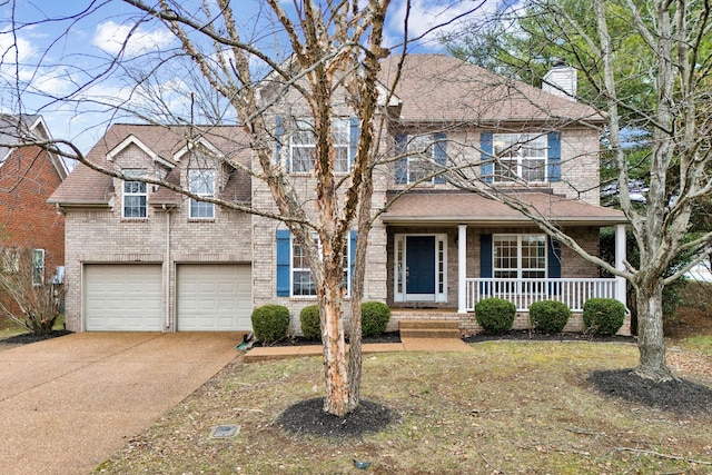 view of front of home featuring a garage and a porch