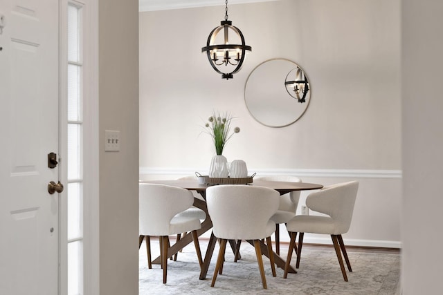 dining space with an inviting chandelier and light wood-type flooring