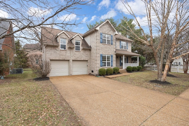 view of front facade featuring cooling unit, a garage, a front lawn, and a porch